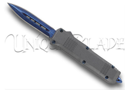Clean Slate Blue Damascus Steel Spear Point Compact OTF Knife - Elevate your EDC with this compact OTF knife featuring a striking blue handle and a precision-crafted Damascus steel spear point blade.
