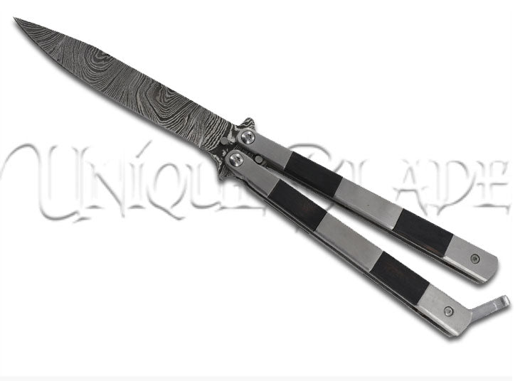 Horror Show Damascus Steel Heavy Duty Fanning Butterfly Knife - Enter the realm of horror with this Damascus steel balisong, featuring G-10 inserts for enhanced grip and a captivating design in every flip.
