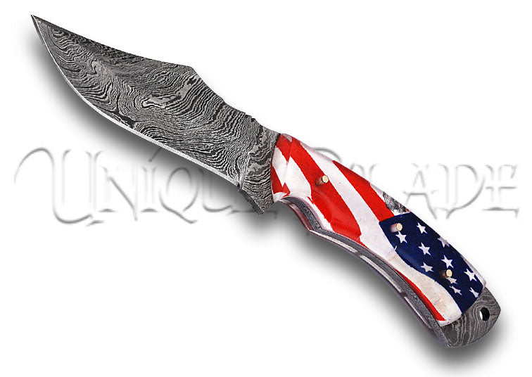 Land of the Free Full Tang Damascus Steel American Flag Handle: Celebrate freedom and craftsmanship with this full tang knife featuring a Damascus steel blade and an American flag handle design.