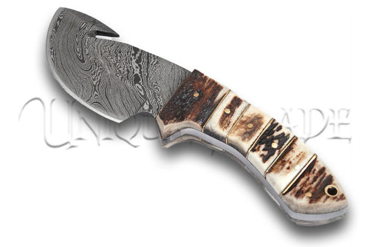 Legacy Damascus Steel Full Tang Stag Handle Gut Hook Outdoor Knife - Embrace the legacy of craftsmanship with this full tang gut hook outdoor knife, featuring a Damascus steel blade and a stag handle for a blend of tradition and functionality.