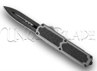 Titan Gray OTF Automatic Knife: Dagger Black - Unleash precision with this out-the-front automatic knife, featuring a sleek dagger-style black blade, all wrapped in a stylish gray design.